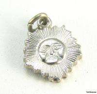 This charm is silver toned. This item is in excellentoriginal and 