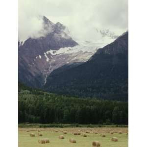  Glacier Descending from Clouded Mountains Contrasts with a 