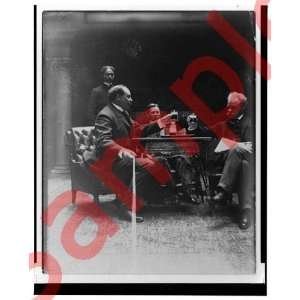   1900 Toast seated men table manipulating camera cord