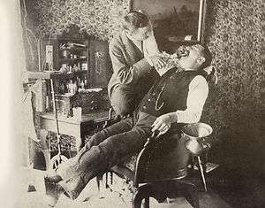 Dentist and patient c.1895 pulling tooth?   large photo  