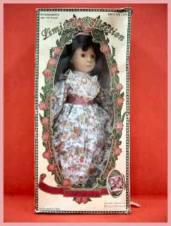 This is a beautiful porcelain doll from the Jacqueline Doll Collection