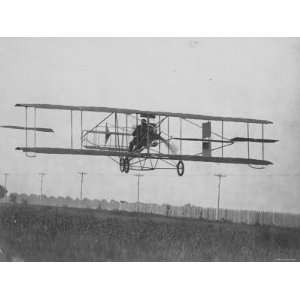 American Aviator and Inventor Glenn Hammond Curtiss Flying His Biplane 