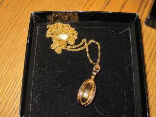 Joan Rivers goldtone egg pendant/necklace  